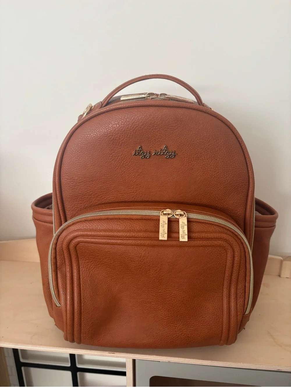 Itzy Ritzy Mini Boss Diaper Bag + Boss Pouch Bundle | Cognac Faux Leather